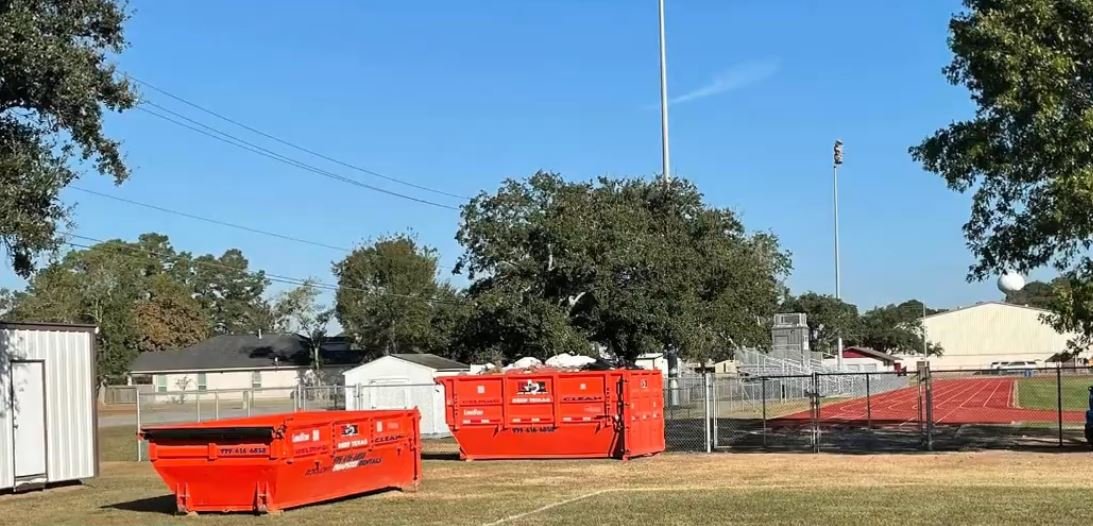 Roll-off truck delivering a dumpster same-day in New Braunfels